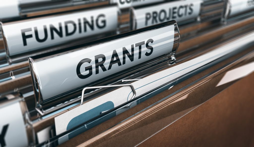 Brown folders have labels that show funding options for Atlanta entrepreneurs and startups.