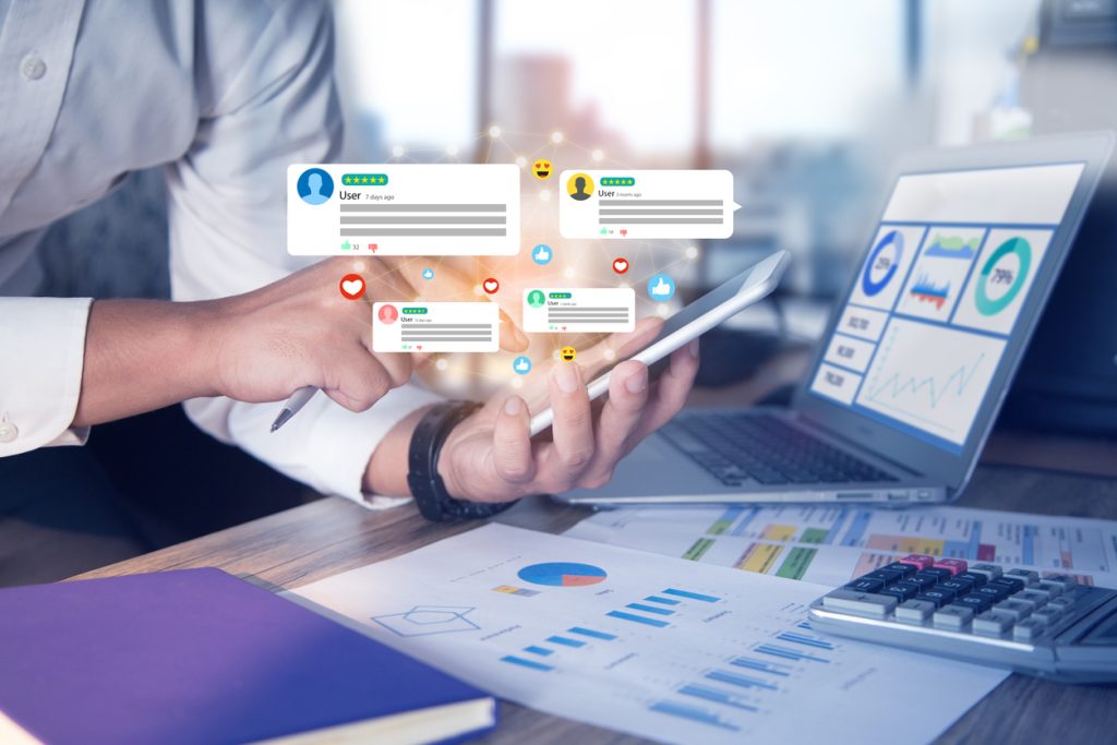 Message bubbles appear next to a phone to illustrate a small business owner using multiple LinkedIn alternatives to business networking in Atlanta.